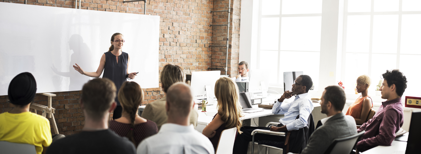Woman presenting to a small class